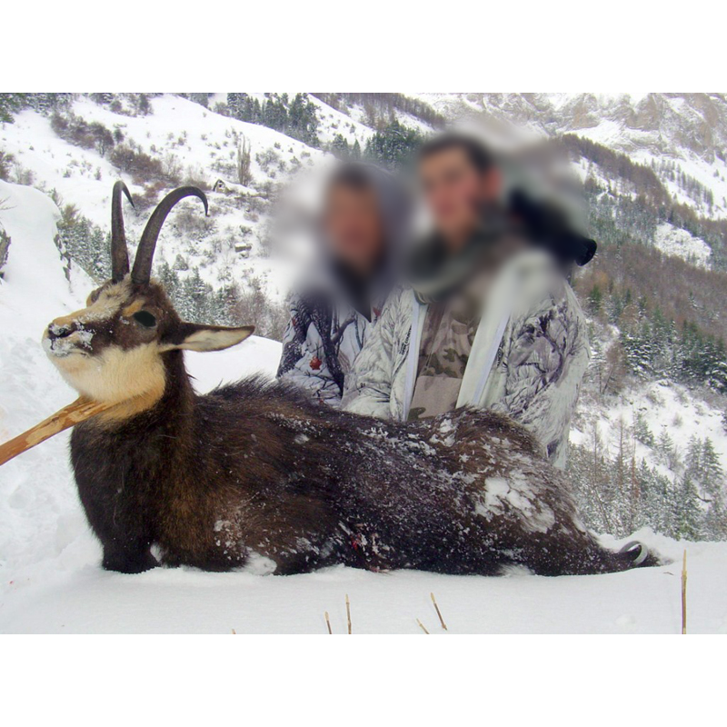 hunters with their chamois trophy in the French snowy moutains