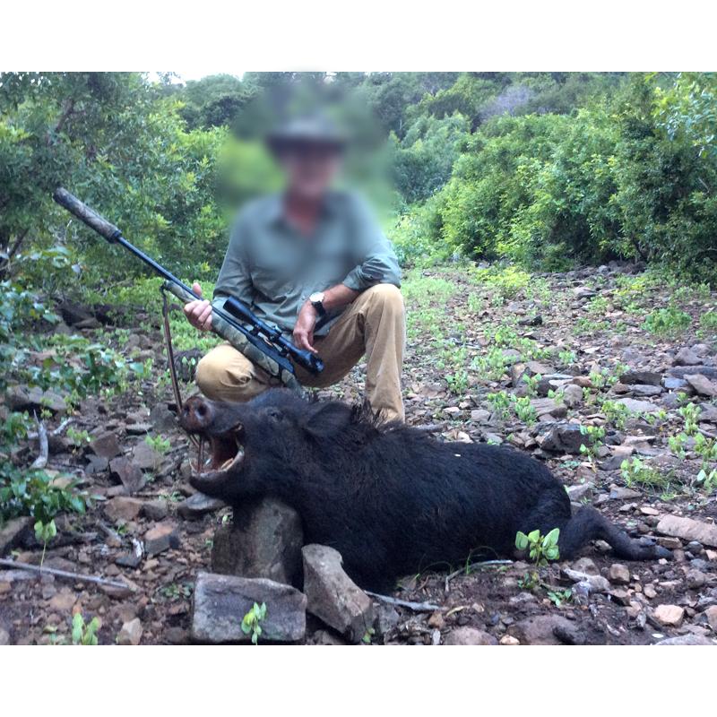 hunter taken with wild boar in Mauritius
