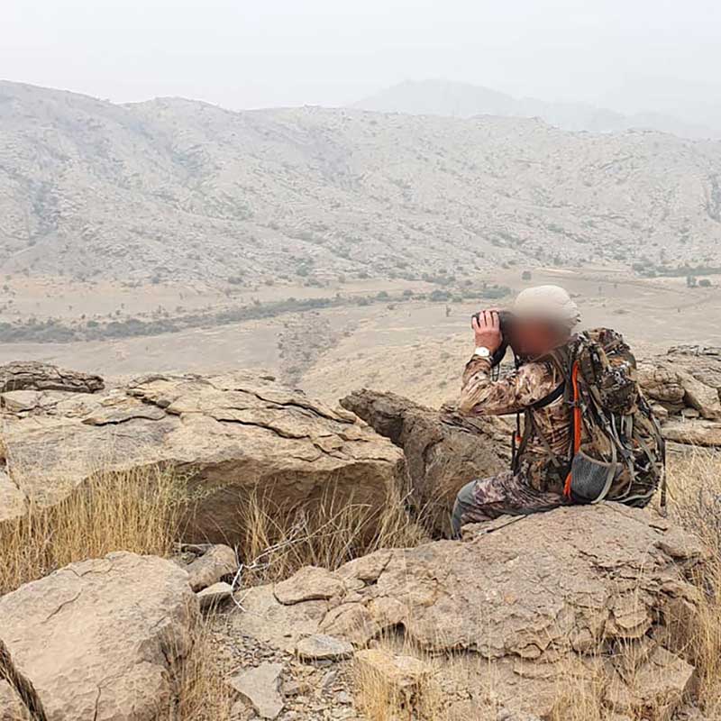 Hunter looking out for urials and ibex in the Pab Hills in Pakistan
